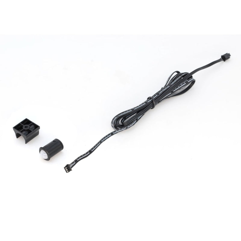 Simple Lighting - PIR Sensor - Bracket, PIR sensor, and the cable on a white surface