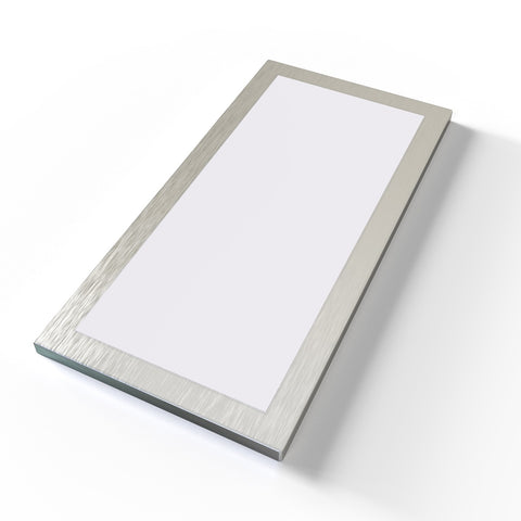 An under-caninet light aid on a white surface, rectangular with a magnetic frame.