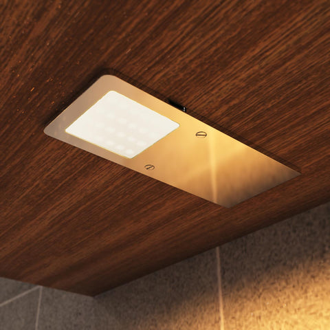 close up of a mounted LED cabinet light with warm white light