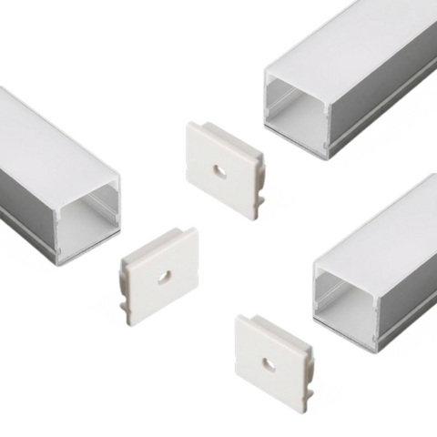 A set of three profile egdes with their end caps on a white background.