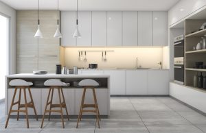 modern kitchen with three pendant lights and white cabinets