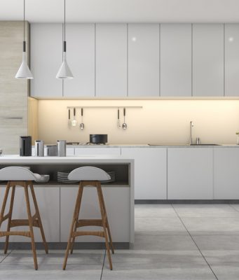 modern kitchen with three pendant lights and white cabinets