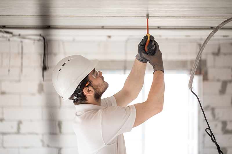 man installing lights