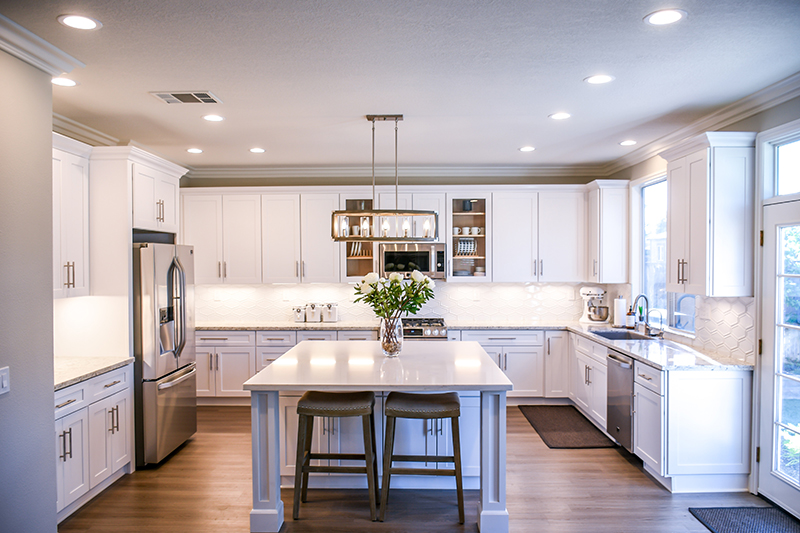 modern kitchen with white cabinets and LED downlights