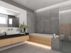Image of a bathroom with wooden cabinets and led downlights and strip lights