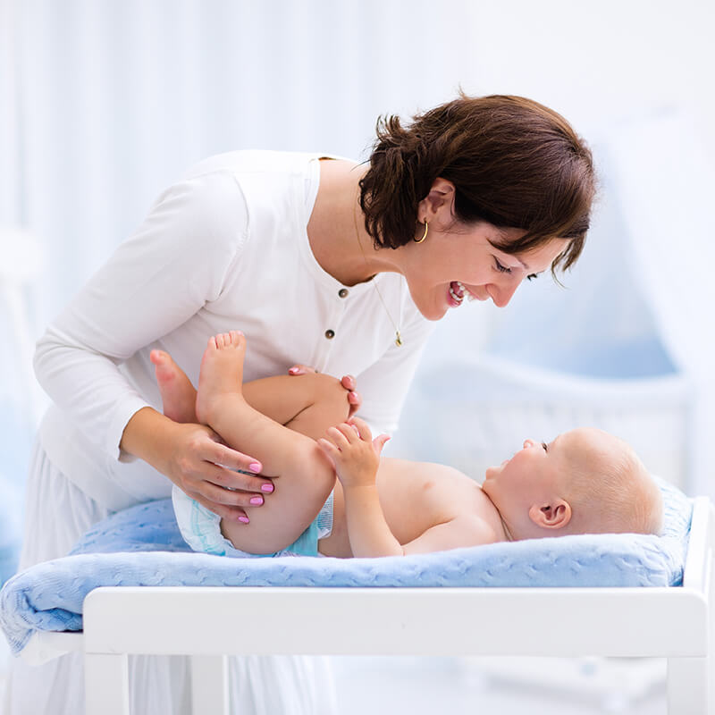 mother and baby smiling at each other