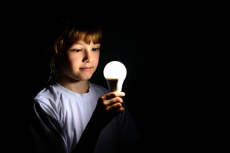 girl holding a bulb