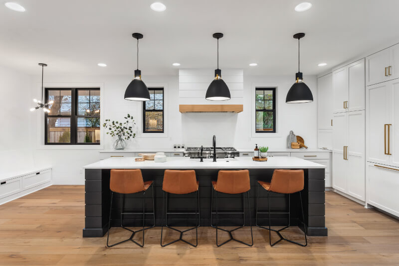 kitchen with three black pendant lamps