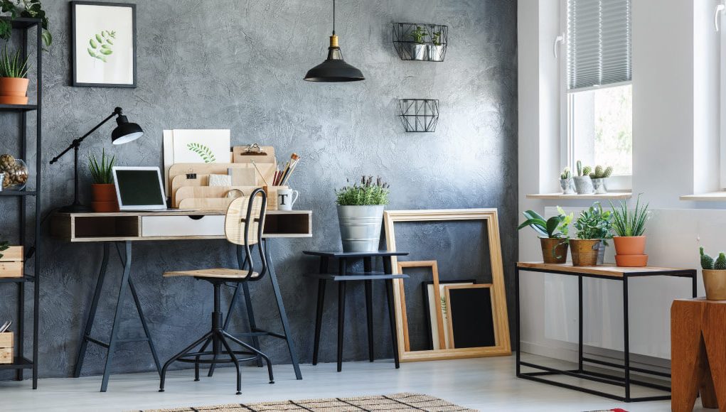 room with a wooden chair and black pendant lamp