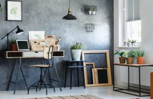 room with a wooden chair and black pendant lamp