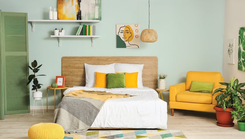 bedroom with yellow and green pillows and furniture