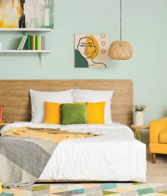 bedroom with yellow and green pillows and furniture