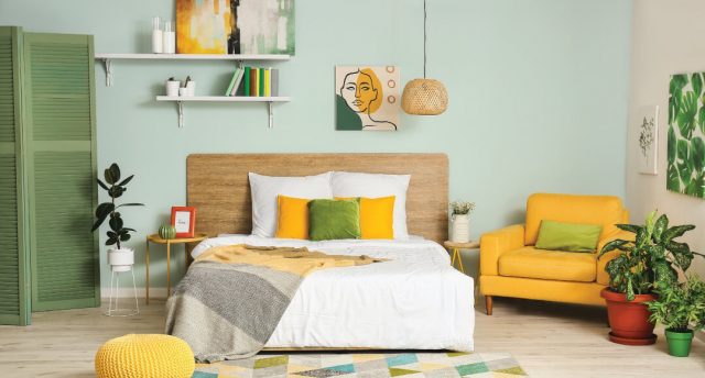bedroom with yellow and green pillows and furniture