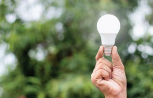 hand holding a light bulb