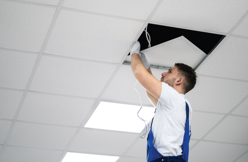 man installing a panel light