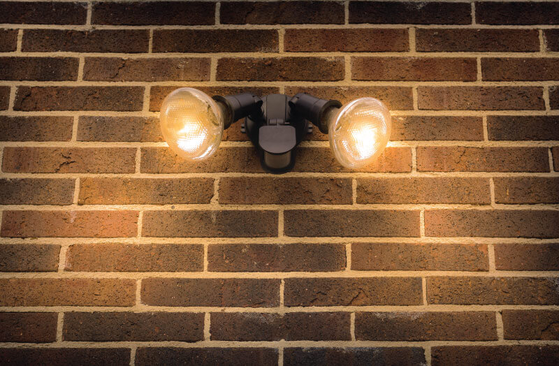 wall lights mounted on a brick wall