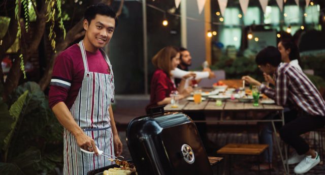 man grilling
