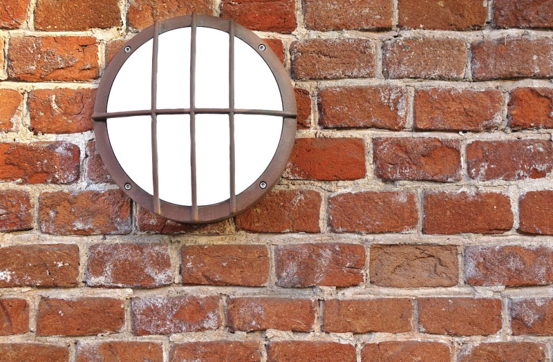 bulkhead light on a brick surface