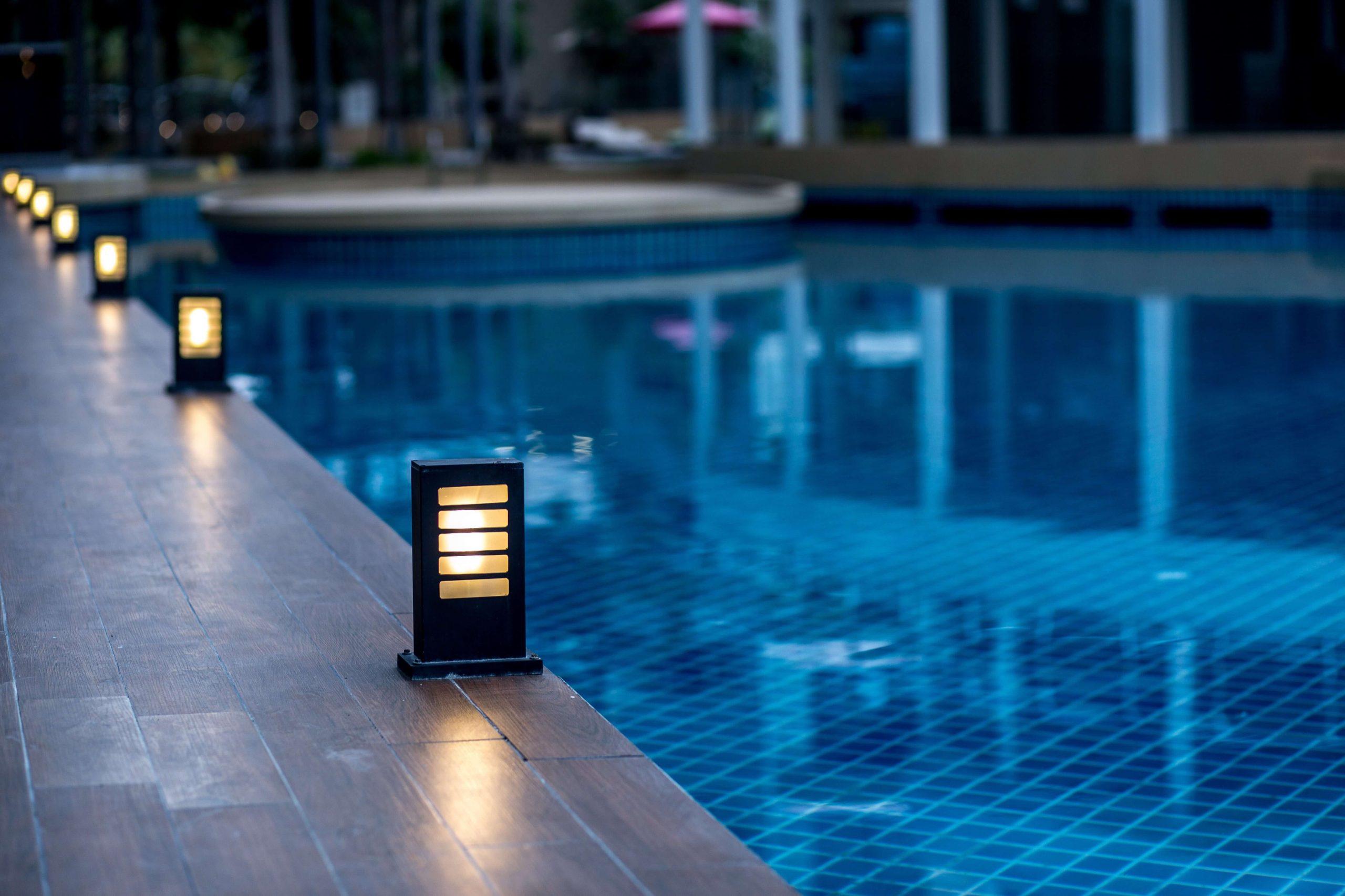 lights surrounding a swimming pool