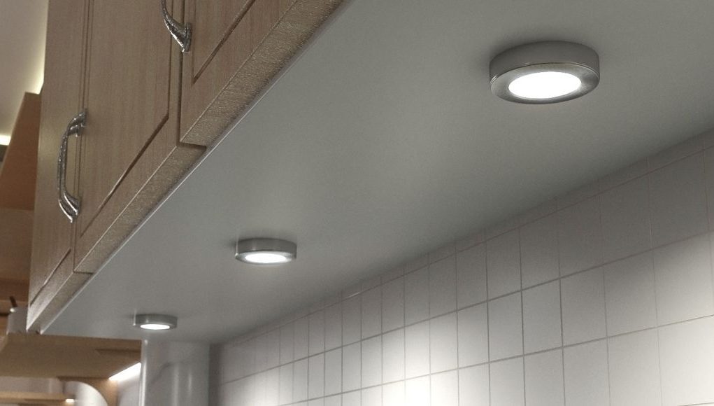 surface mounted under cabinet lights beneath a kitchen cabinet