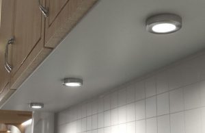 surface mounted under cabinet lights beneath a kitchen cabinet