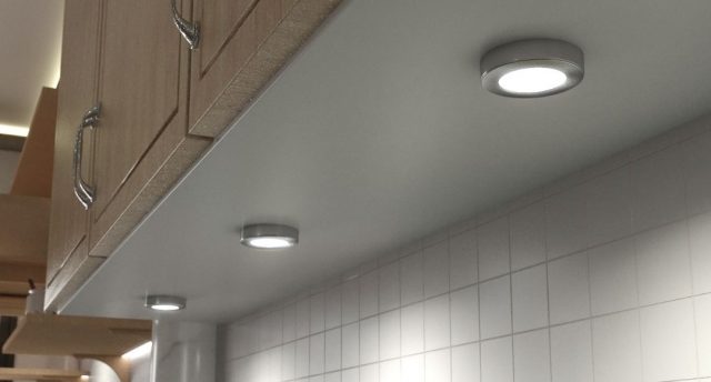 surface mounted under cabinet lights beneath a kitchen cabinet