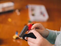 boy holding Legos