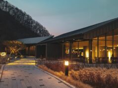 brown house with interior and exterior lights