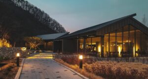 brown house with interior and exterior lights