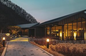 brown house with interior and exterior lights