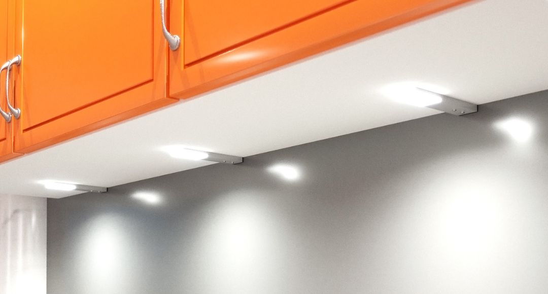 under cabinet lights with orange cabinets