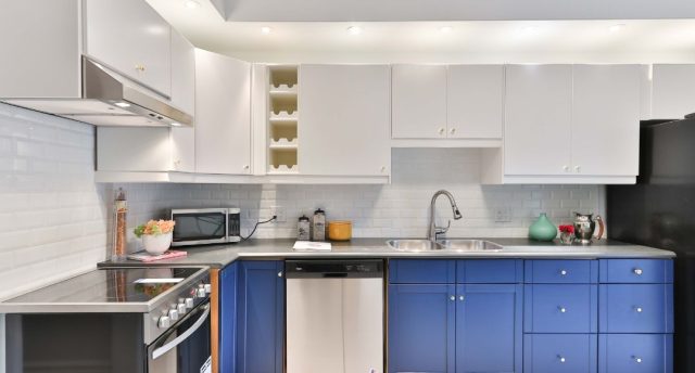 modern kitchen with blue cabinets