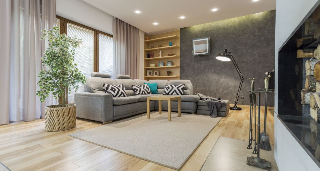 living room with downlights and a floor lamp