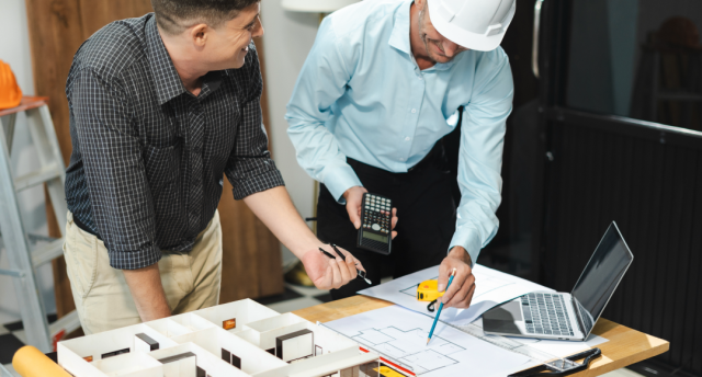 Two contractors planning.