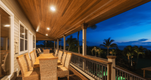 An elevated patio illuminated by LED downlights.