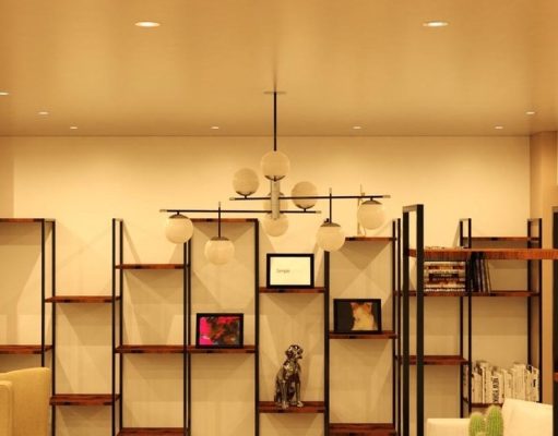 Living room display shelf illuminated by fire-rated LED downlights.