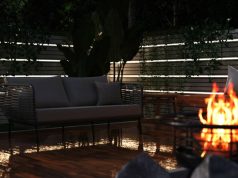 garden area with LED strip lights and fire