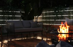 garden area with LED strip lights and fire