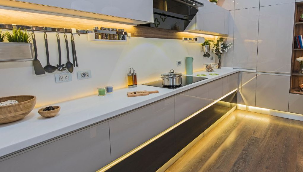 A complete kitchen with lighted LED strip lights