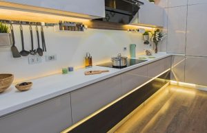 A complete kitchen with lighted LED strip lights