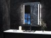 Lighted LED bathroom mirror over black tiles