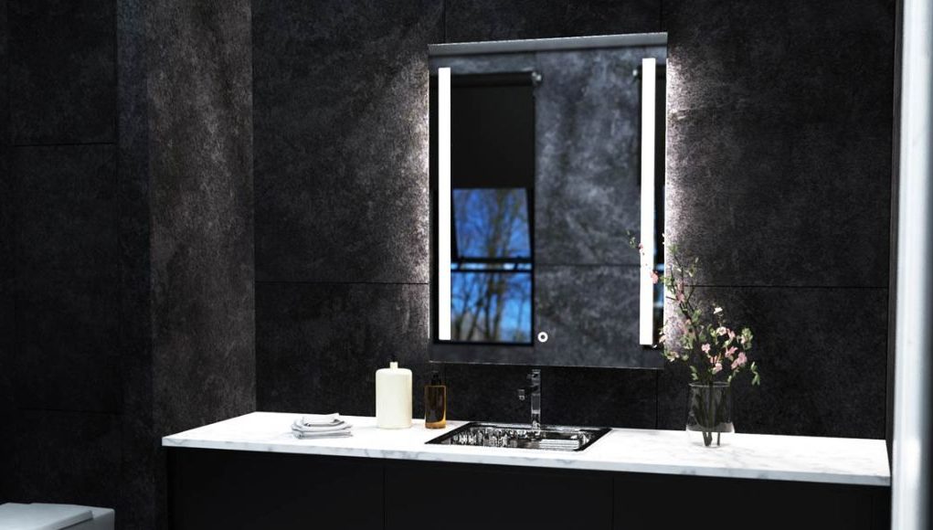 Lighted LED bathroom mirror over black tiles