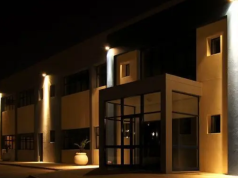 modern home brightened by LED flood lights