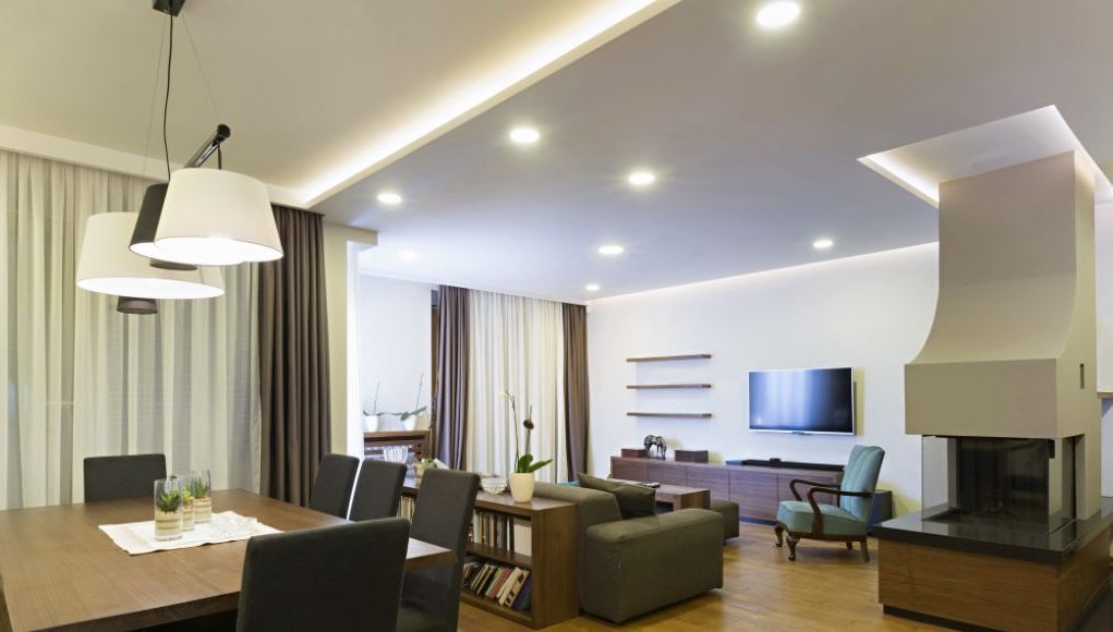 dining and living area with visible downlights and led strip lighting