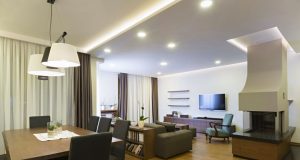dining and living area with visible downlights and led strip lighting