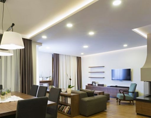 dining and living area with visible downlights and led strip lighting