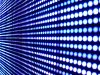 Close-up image of an LED screen, showing rows of circle lights
