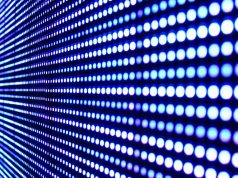 Close-up image of an LED screen, showing rows of circle lights