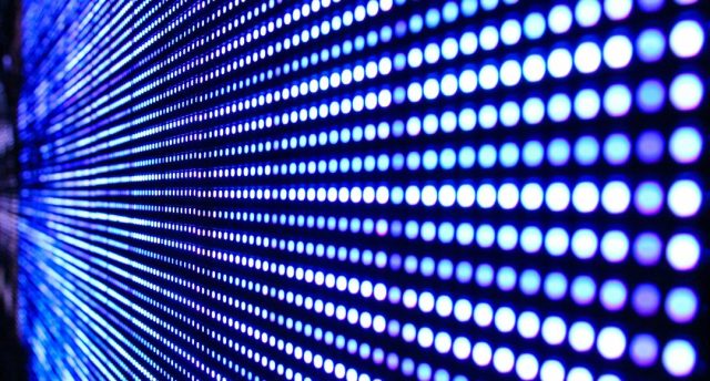Close-up image of an LED screen, showing rows of circle lights