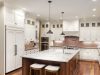 Dining room with a centre island and different lights installed